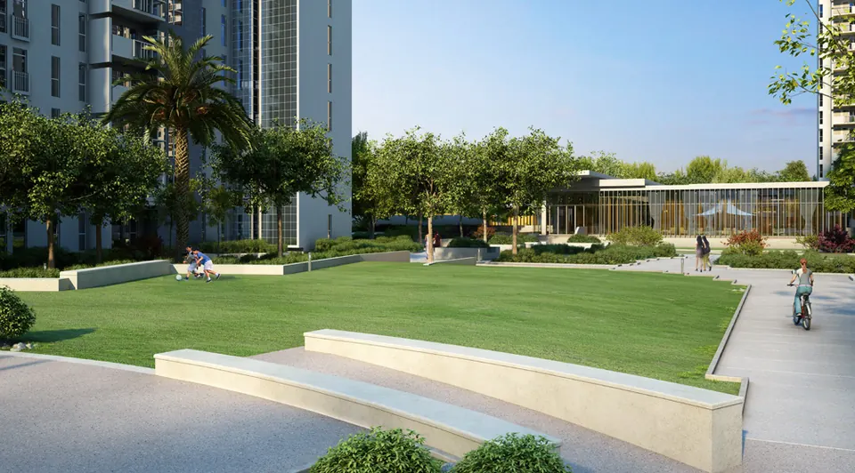 An open lawn with a cycle path and the clubhouse pavilion, artist's impression